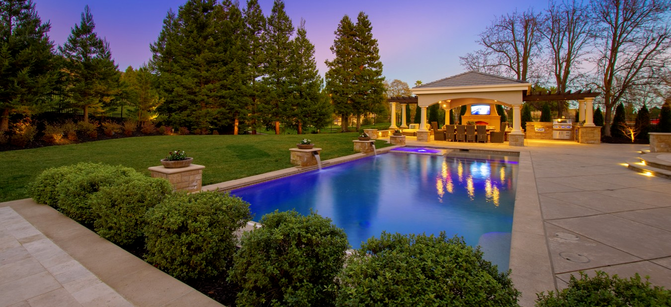 Pool renovation with lighting, water features and pavilion