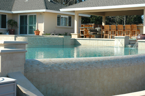 swimming pool design with infinity edge and dam wall